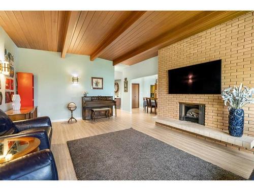 3615 Umber Place Nw, Calgary, AB - Indoor Photo Showing Living Room With Fireplace