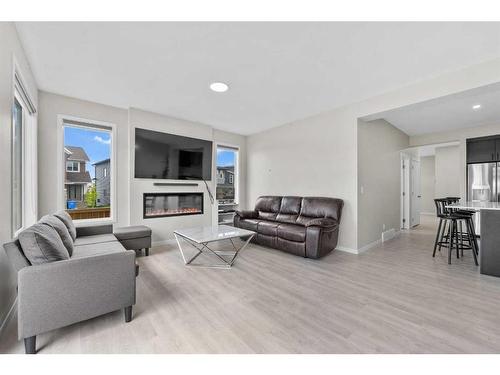 9 Corner Meadows Grove Ne, Calgary, AB - Indoor Photo Showing Living Room With Fireplace