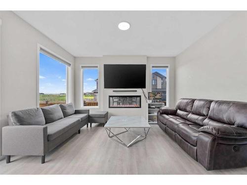 9 Corner Meadows Grove Ne, Calgary, AB - Indoor Photo Showing Living Room With Fireplace