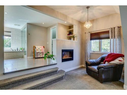 39 Canova Close Sw, Calgary, AB - Indoor Photo Showing Living Room With Fireplace