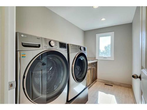 39 Canova Close Sw, Calgary, AB - Indoor Photo Showing Laundry Room