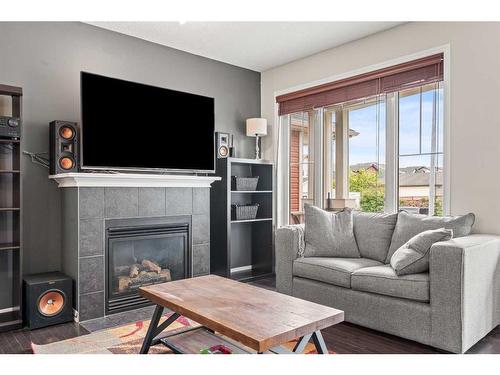 176 New Brighton Green Se, Calgary, AB - Indoor Photo Showing Living Room With Fireplace