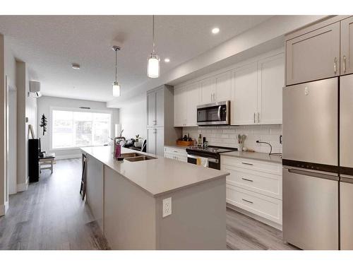 407-1702 17 Avenue Sw, Calgary, AB - Indoor Photo Showing Kitchen With Stainless Steel Kitchen With Double Sink With Upgraded Kitchen