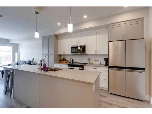 407-1702 17 Avenue Sw, Calgary, AB - Indoor Photo Showing Kitchen With Stainless Steel Kitchen With Double Sink With Upgraded Kitchen