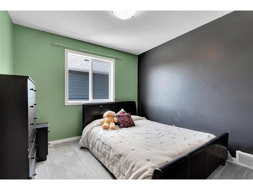 12 Legacy Bay Se, Calgary, AB - Indoor Photo Showing Bedroom