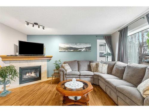 189 Cranfield Green Se, Calgary, AB - Indoor Photo Showing Living Room With Fireplace