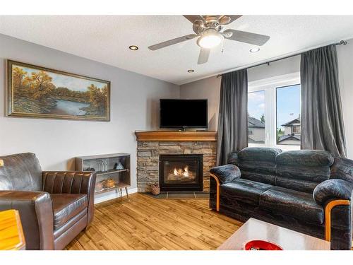 189 Cranfield Green Se, Calgary, AB - Indoor Photo Showing Living Room With Fireplace