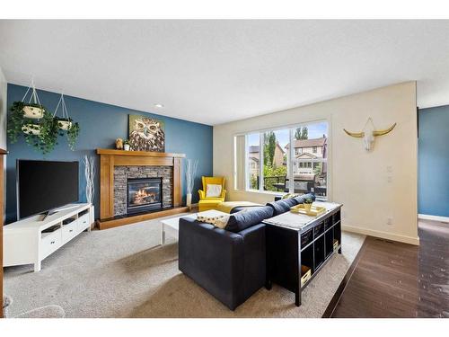 59 Elgin Estates Hill Se, Calgary, AB - Indoor Photo Showing Living Room With Fireplace