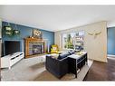 59 Elgin Estates Hill Se, Calgary, AB  - Indoor Photo Showing Living Room With Fireplace 