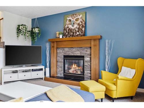 59 Elgin Estates Hill Se, Calgary, AB - Indoor Photo Showing Living Room With Fireplace