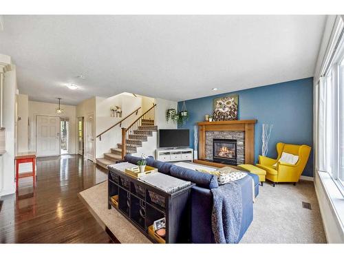 59 Elgin Estates Hill Se, Calgary, AB - Indoor Photo Showing Living Room With Fireplace