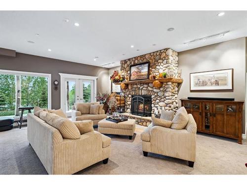 309 Wild Rose Close, Rural Rocky View County, AB - Indoor Photo Showing Living Room With Fireplace