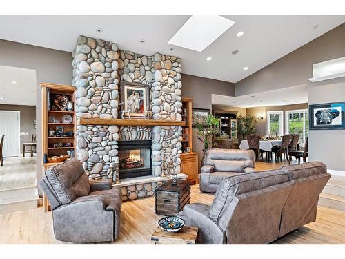 309 Wild Rose Close, Rural Rocky View County, AB - Indoor Photo Showing Living Room With Fireplace