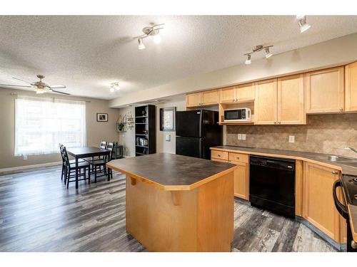 1807-140 Sagewood Boulevard Sw, Airdrie, AB - Indoor Photo Showing Kitchen With Double Sink