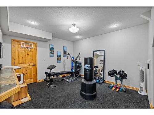 27 Woodlands Estates Crescent, Rural Rocky View County, AB - Indoor Photo Showing Gym Room