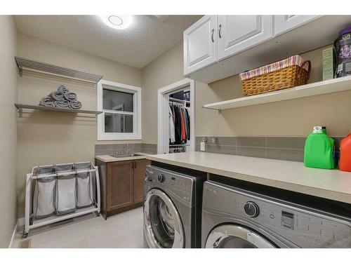 233 Kingsmere Cove Se, Airdrie, AB - Indoor Photo Showing Laundry Room