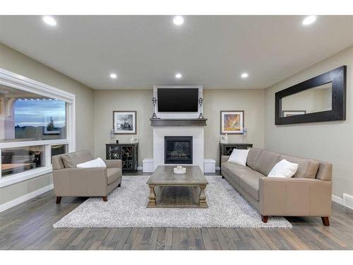 233 Kingsmere Cove Se, Airdrie, AB - Indoor Photo Showing Living Room With Fireplace