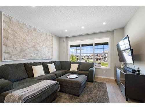 154 Magnolia Square Se, Calgary, AB - Indoor Photo Showing Living Room