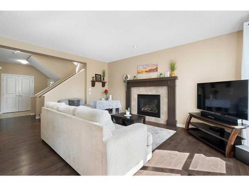 325 Kings Heights Drive Se, Airdrie, AB - Indoor Photo Showing Living Room With Fireplace