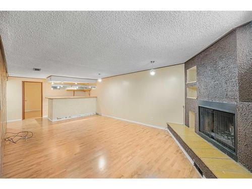 1791 66 Avenue Se, Calgary, AB - Indoor With Fireplace