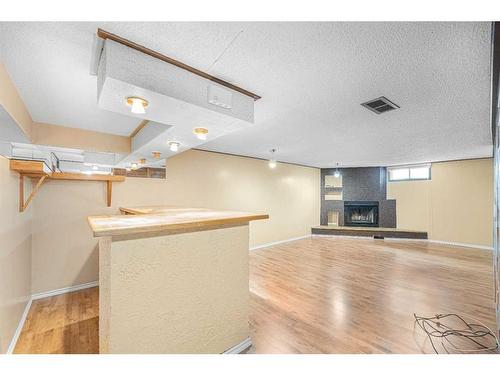 1791 66 Avenue Se, Calgary, AB - Indoor With Fireplace