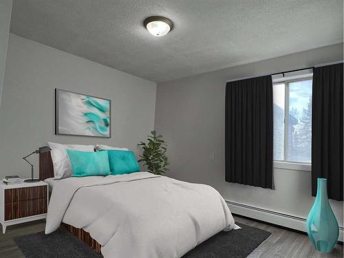 105 First Avenue East, Cochrane, AB - Indoor Photo Showing Bedroom