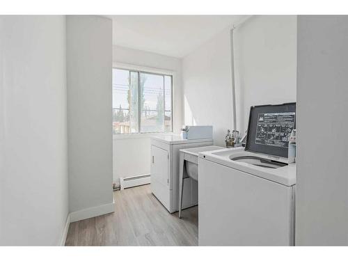 105 First Avenue East, Cochrane, AB - Indoor Photo Showing Laundry Room