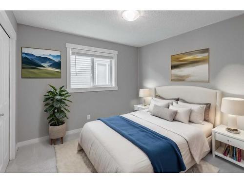 209 Kingsmere Cove Se, Airdrie, AB - Indoor Photo Showing Bedroom