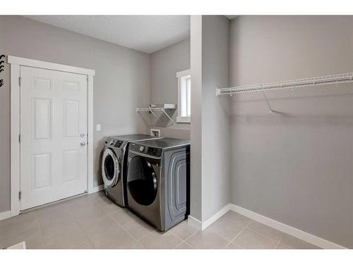 209 Kingsmere Cove Se, Airdrie, AB - Indoor Photo Showing Laundry Room