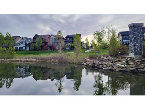 209 Kingsmere Cove Se, Airdrie, AB - Outdoor With Body Of Water