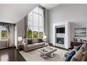 209 Kingsmere Cove Se, Airdrie, AB  - Indoor Photo Showing Living Room With Fireplace 