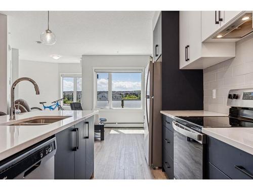 602-238 Sage Valley Common Nw, Calgary, AB - Indoor Photo Showing Kitchen With Double Sink With Upgraded Kitchen