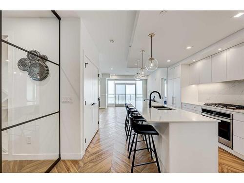 510-8505 Broadcast Avenue Sw, Calgary, AB - Indoor Photo Showing Kitchen With Double Sink With Upgraded Kitchen