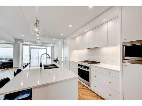 510-8505 Broadcast Avenue Sw, Calgary, AB - Indoor Photo Showing Kitchen With Double Sink With Upgraded Kitchen