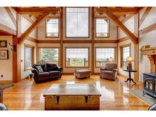 373195 48 Street West, Rural Foothills County, AB - Indoor Photo Showing Living Room With Fireplace