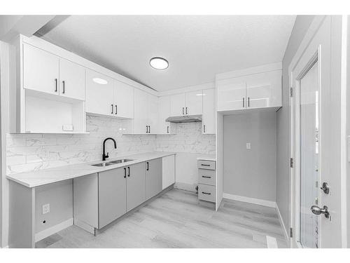 6403 Centre Street Nw, Calgary, AB - Indoor Photo Showing Kitchen With Double Sink