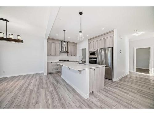 693 Creekmill Court Sw, Airdrie, AB - Indoor Photo Showing Kitchen With Stainless Steel Kitchen With Upgraded Kitchen
