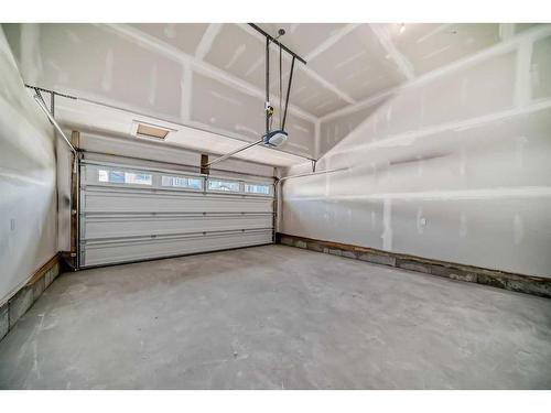 693 Creekmill Court Sw, Airdrie, AB - Indoor Photo Showing Garage