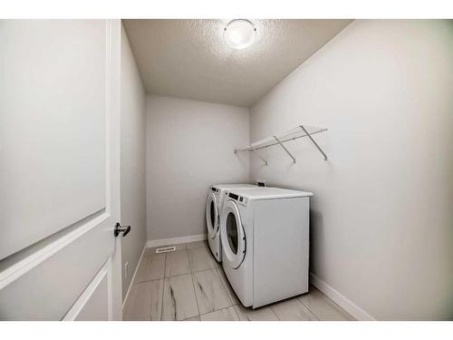 693 Creekmill Court Sw, Airdrie, AB - Indoor Photo Showing Laundry Room