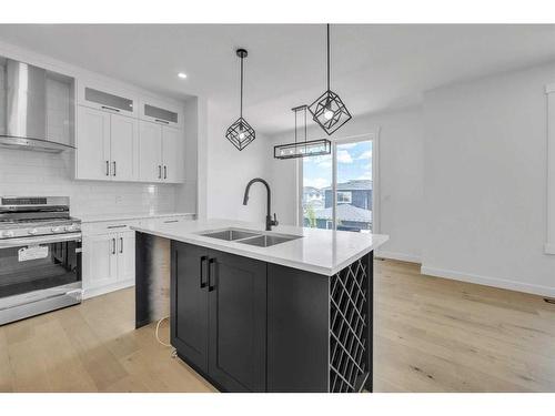 122 Baysprings Gardens, Airdrie, AB - Indoor Photo Showing Kitchen With Double Sink With Upgraded Kitchen