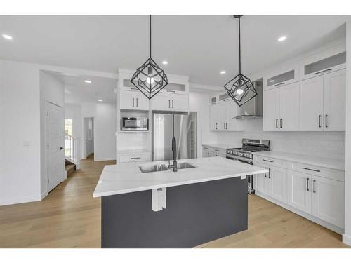 122 Baysprings Gardens, Airdrie, AB - Indoor Photo Showing Kitchen With Stainless Steel Kitchen With Upgraded Kitchen