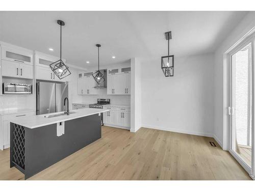 122 Baysprings Gardens, Airdrie, AB - Indoor Photo Showing Kitchen With Upgraded Kitchen