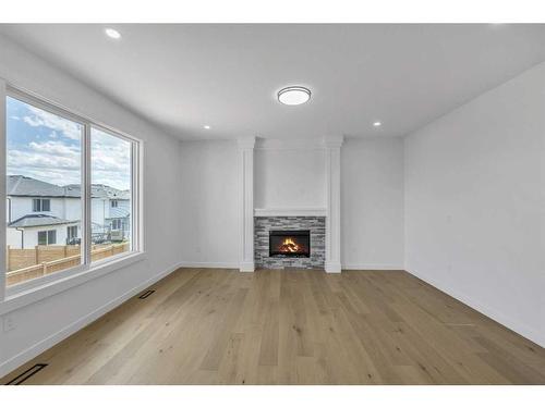 122 Baysprings Gardens, Airdrie, AB - Indoor Photo Showing Living Room With Fireplace