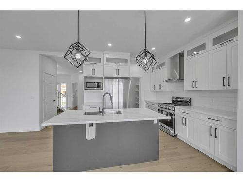 122 Baysprings Gardens, Airdrie, AB - Indoor Photo Showing Kitchen With Upgraded Kitchen