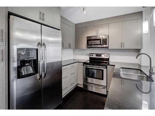 1308-240 Skyview Ranch Road Ne, Calgary, AB - Indoor Photo Showing Kitchen With Stainless Steel Kitchen With Double Sink With Upgraded Kitchen