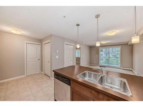 2317-130 Panatella Street Nw, Calgary, AB - Indoor Photo Showing Kitchen With Double Sink