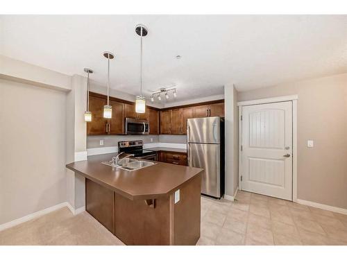 2317-130 Panatella Street Nw, Calgary, AB - Indoor Photo Showing Kitchen With Stainless Steel Kitchen With Double Sink