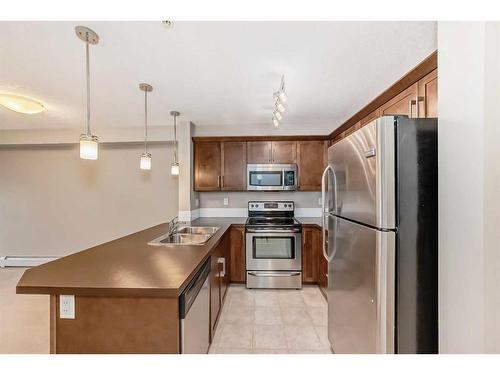 2317-130 Panatella Street Nw, Calgary, AB - Indoor Photo Showing Kitchen With Stainless Steel Kitchen With Double Sink