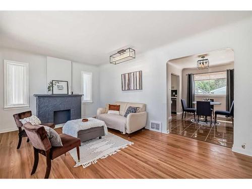 11419 111A Avenue Nw, Edmonton, AB - Indoor Photo Showing Living Room With Fireplace