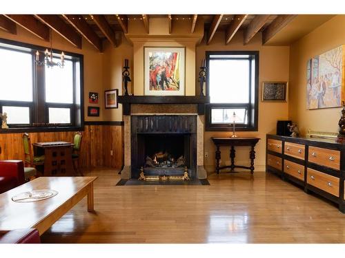 129 3 Avenue Sw, High River, AB - Indoor Photo Showing Living Room With Fireplace